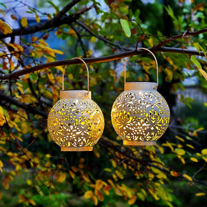 2-Pack Outdoor Solar Hanging Lanterns - Metal LED Decorative Lights for Garden, Patio, Courtyard, Lawn, and Tabletop with Hollowed-Out Design in White.